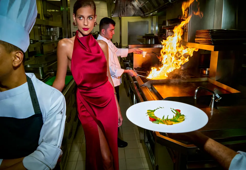 A dish finished over the flame in the open kitchen at Address Downtown
