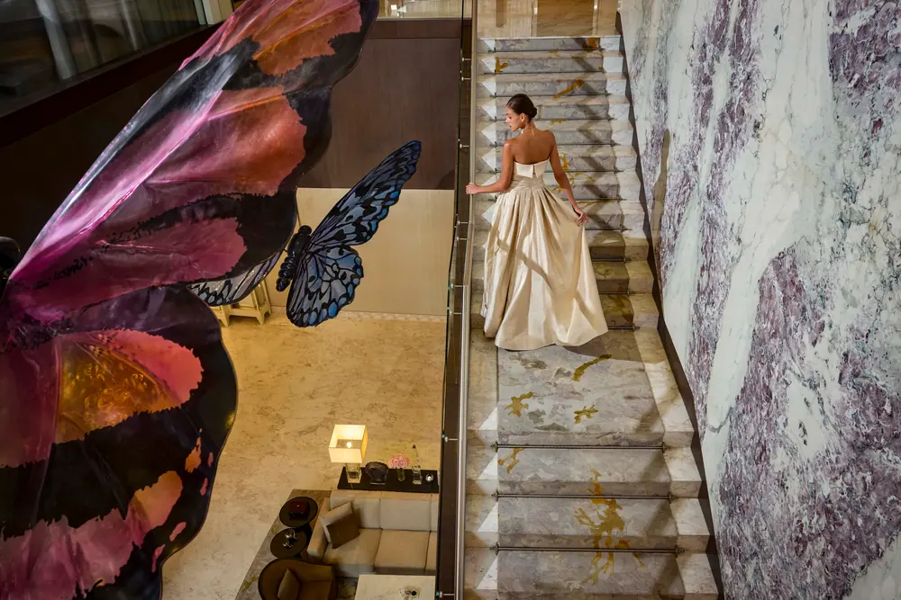 The staircase and butterfly artwork in the interior at Address Downtown