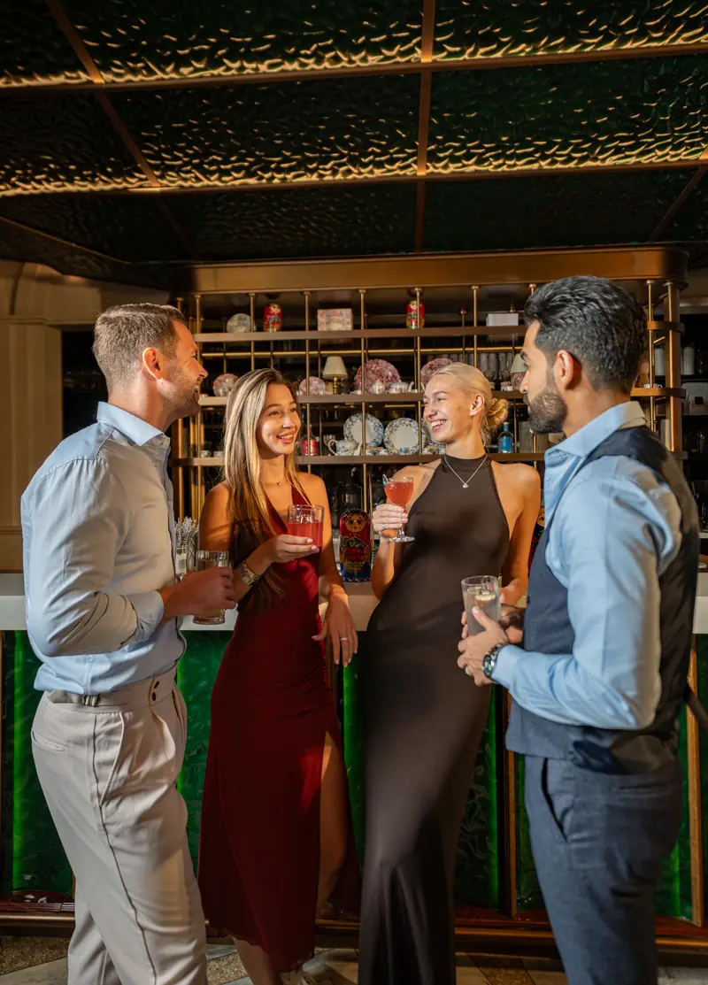 Guests with drinks at the bar at Blume Dubai Mall