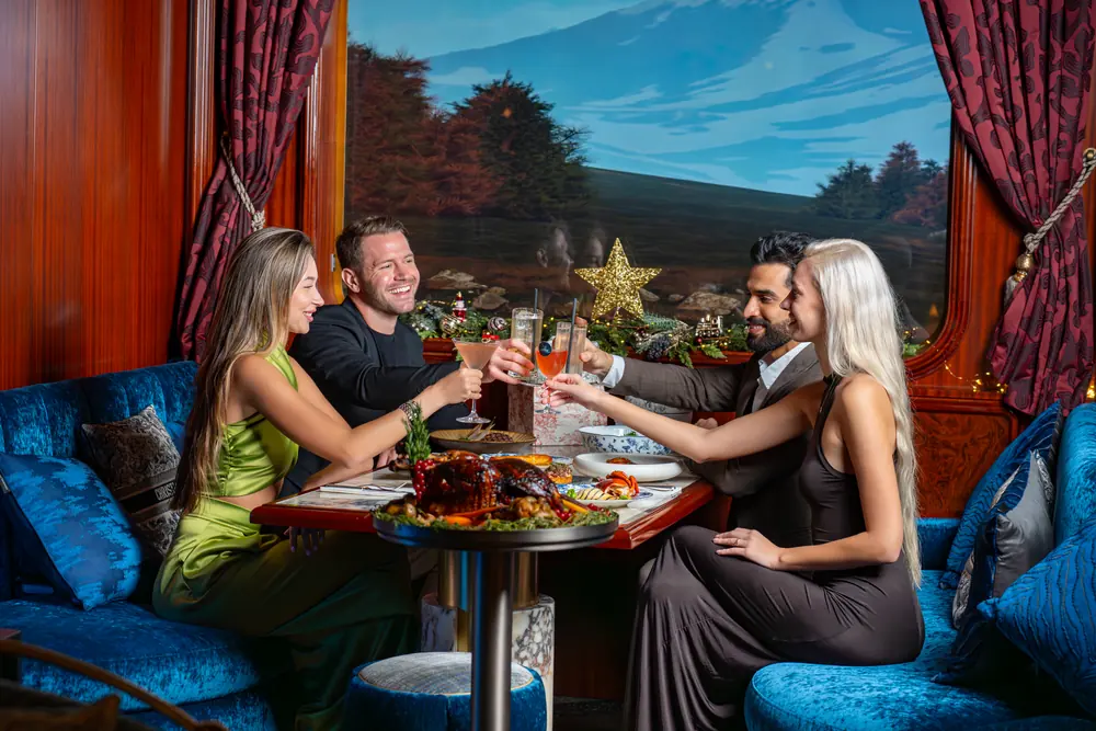 Guests dining in the carriage-style room at Blume Dubai Mall