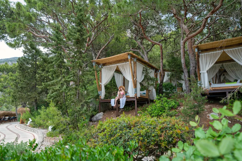 Cabanas set among the pines in the grounds of Liberty Lykia
