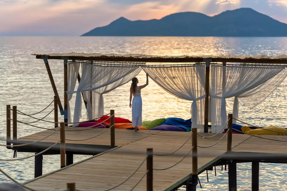 A curtained pavilion on the sea jetty at Liberty Lykia