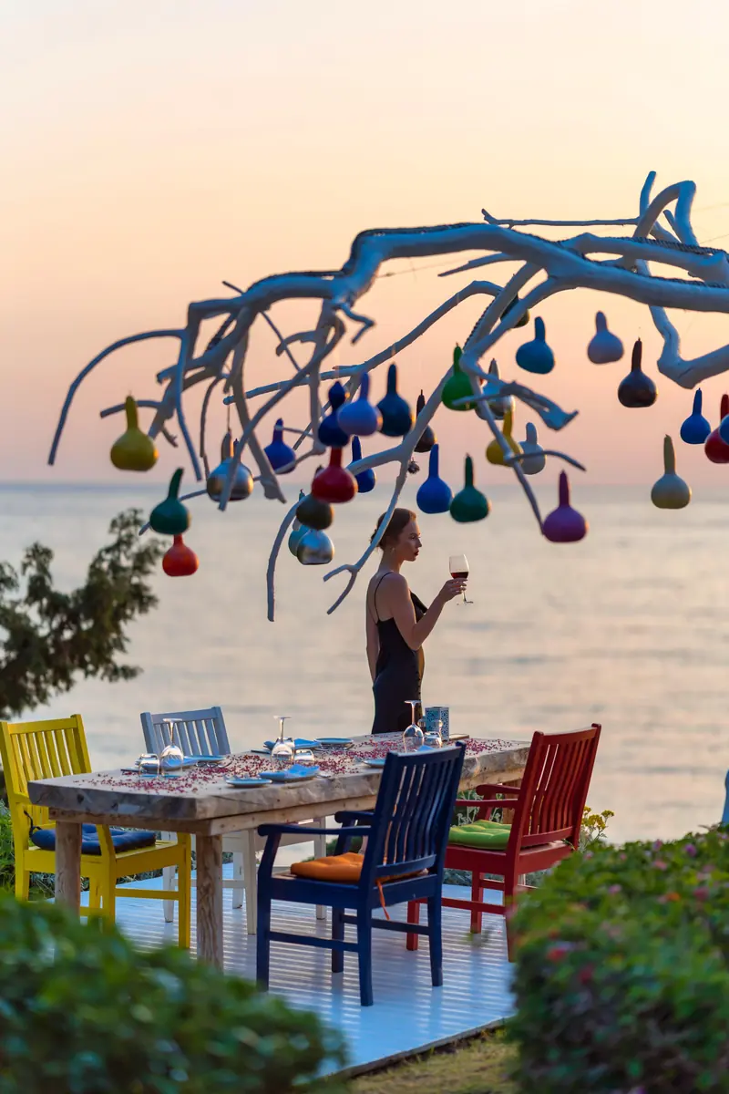 The coloured glass lantern tree over the terrace table at Liberty Lykia