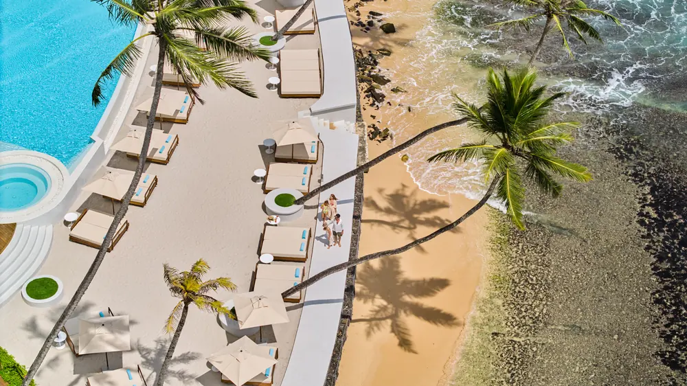 The pool deck meeting the beach at Radisson Collection Galle, photographed from the air