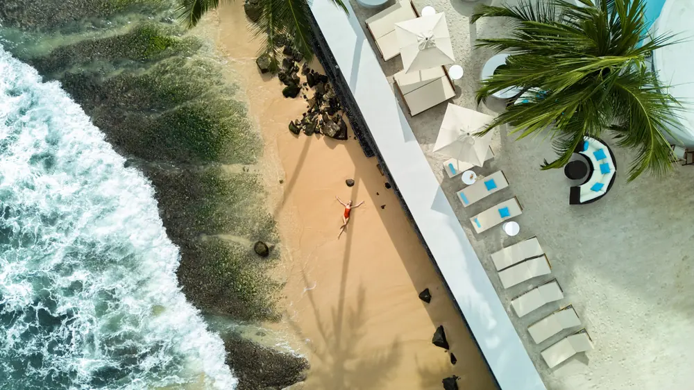 Surf breaking beside the pool terrace at Radisson Collection Galle