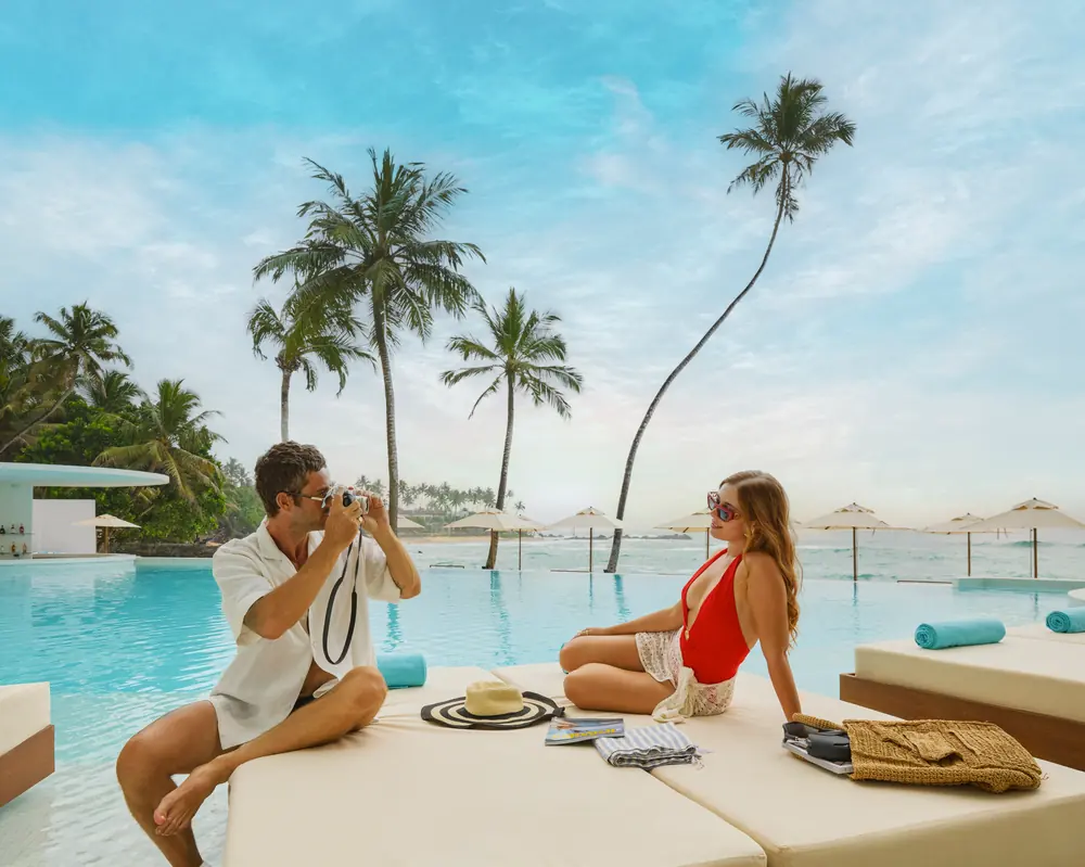 A picnic laid out on a poolside daybed at Radisson Collection Galle